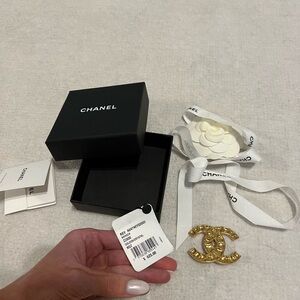 Brand new with tag gold Chanel brooch